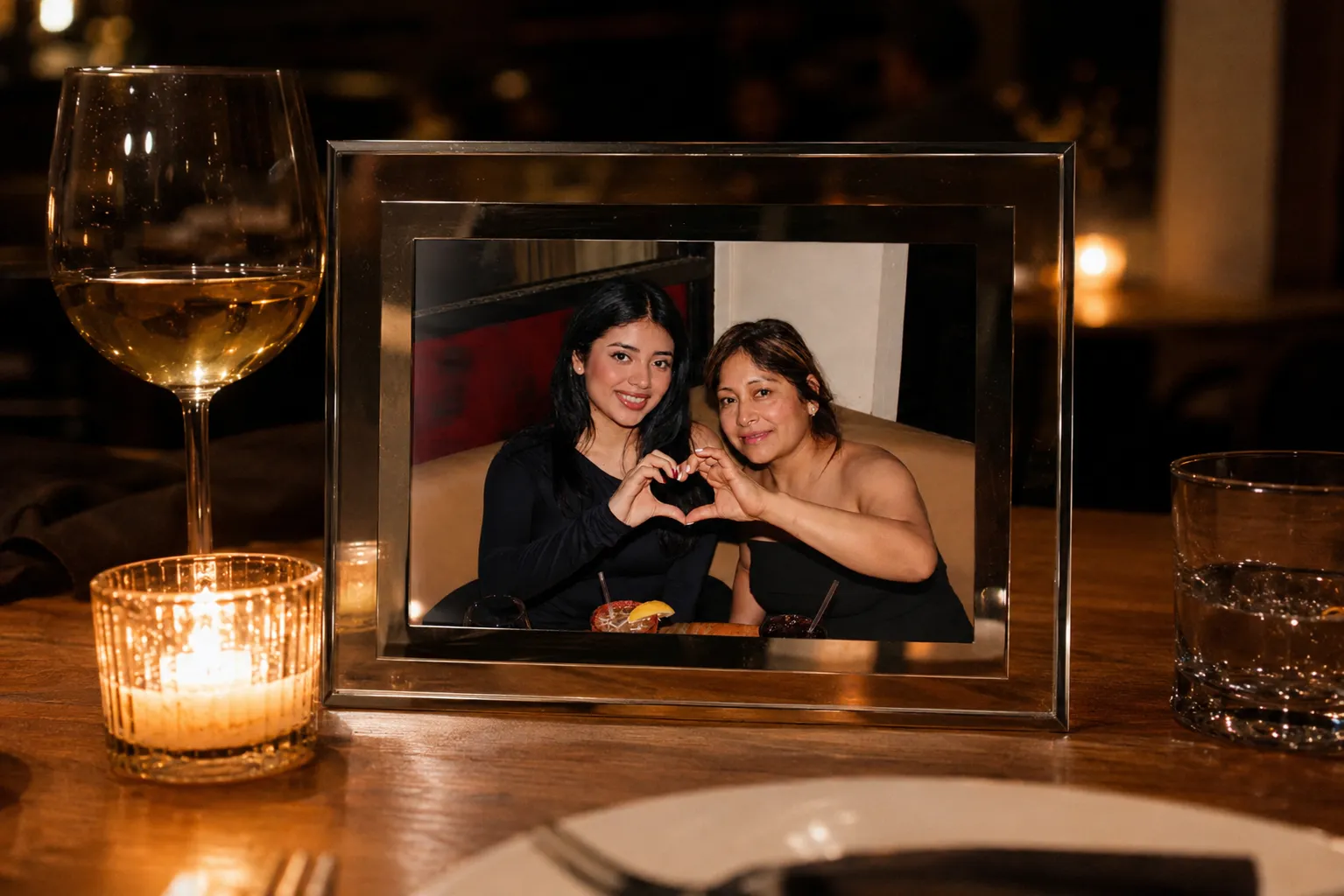 A printed photo in a branded frame, ready for guests to take home